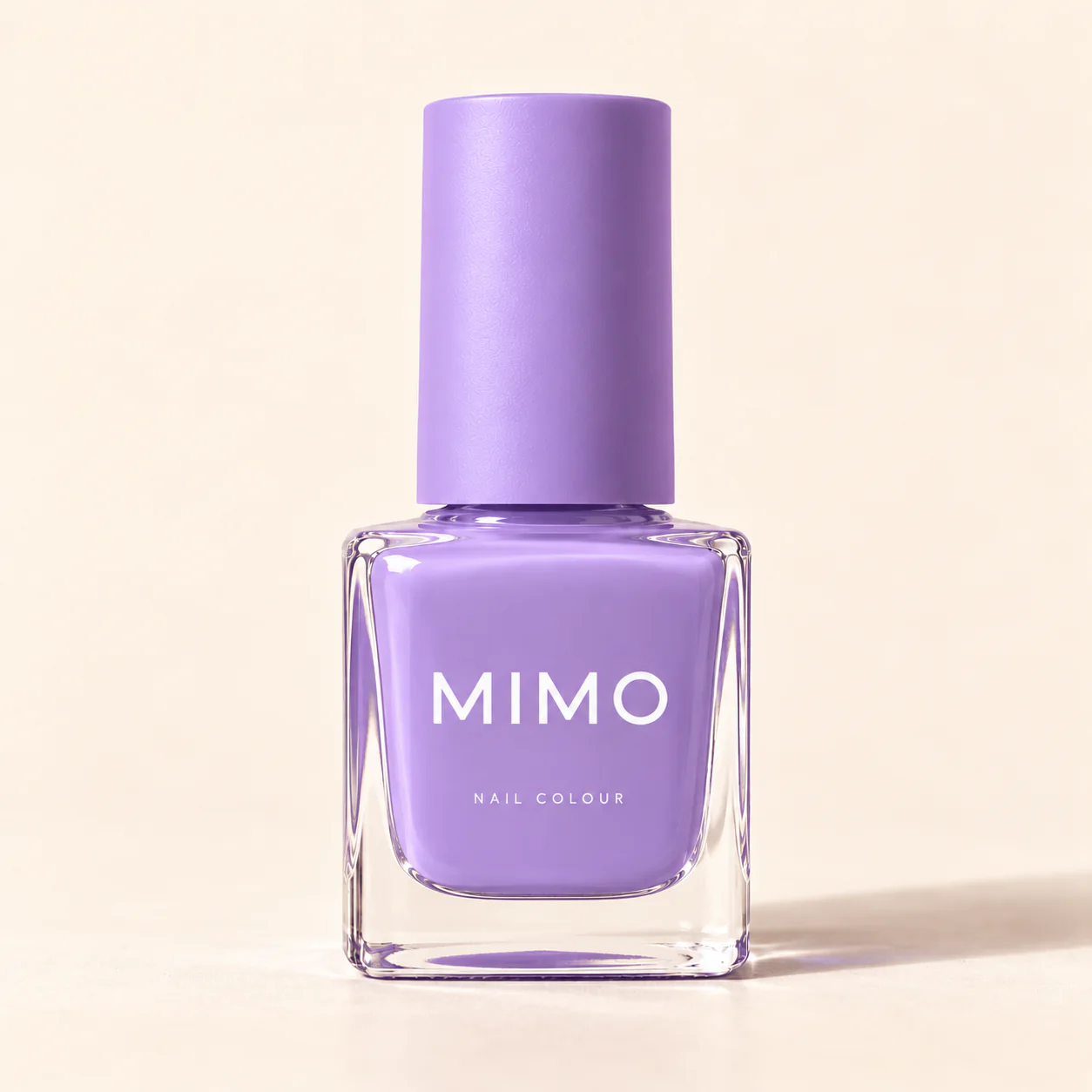 สีทาเล็บ MIMO สีลาเวนเดอร์ ขวดแก้วทรงเหลี่ยม ฝาสีเดียวกัน บนพื้นสีครีม