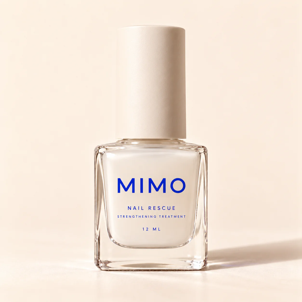 MIMO Nail Rescue ขวดแก้วทรงเหลี่ยม ฝาสีครีม ตัวอักษรสีน้ำเงิน
