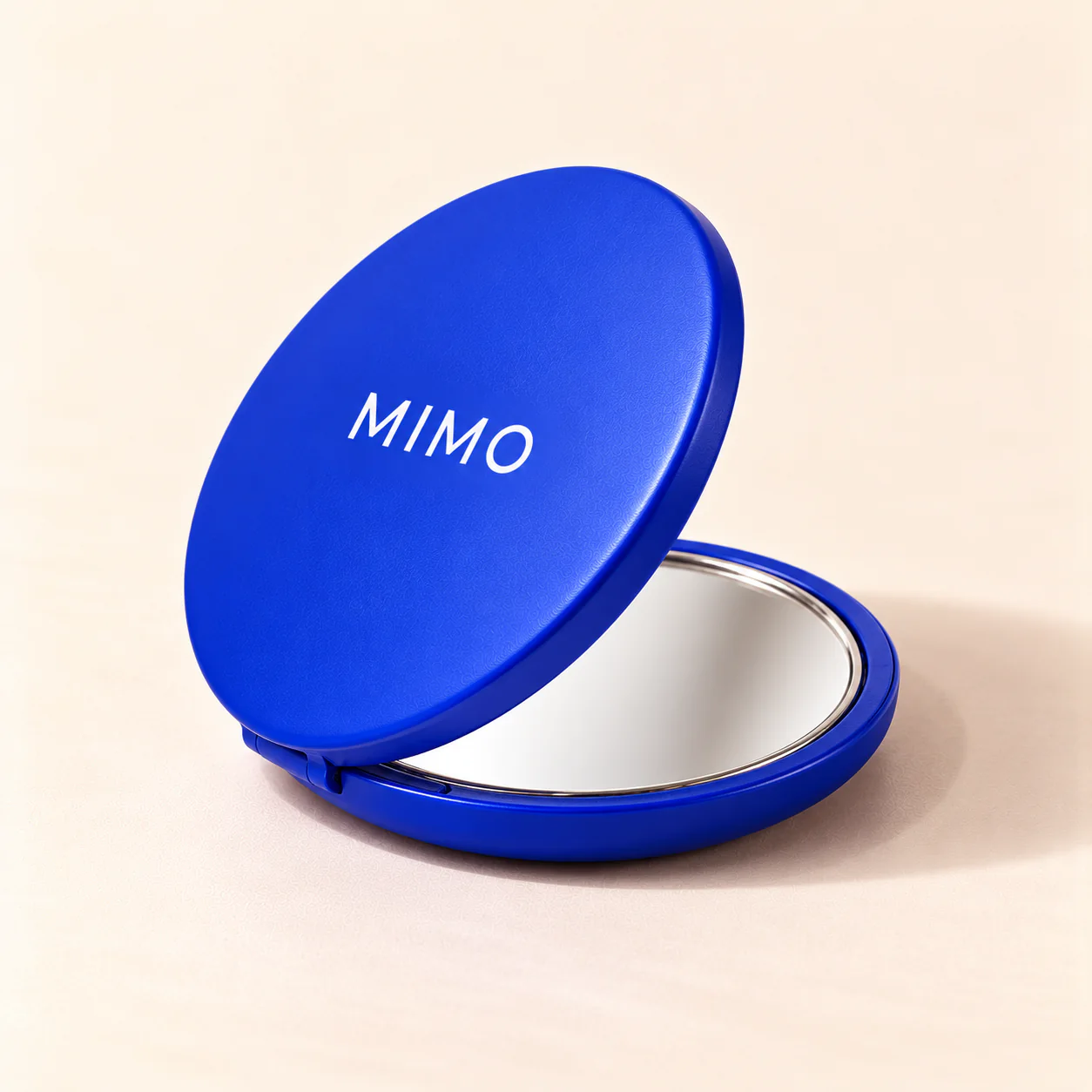 กระจกพกพา MIMO ตลับกลมสีน้ำเงิน เปิดครึ่งหนึ่ง