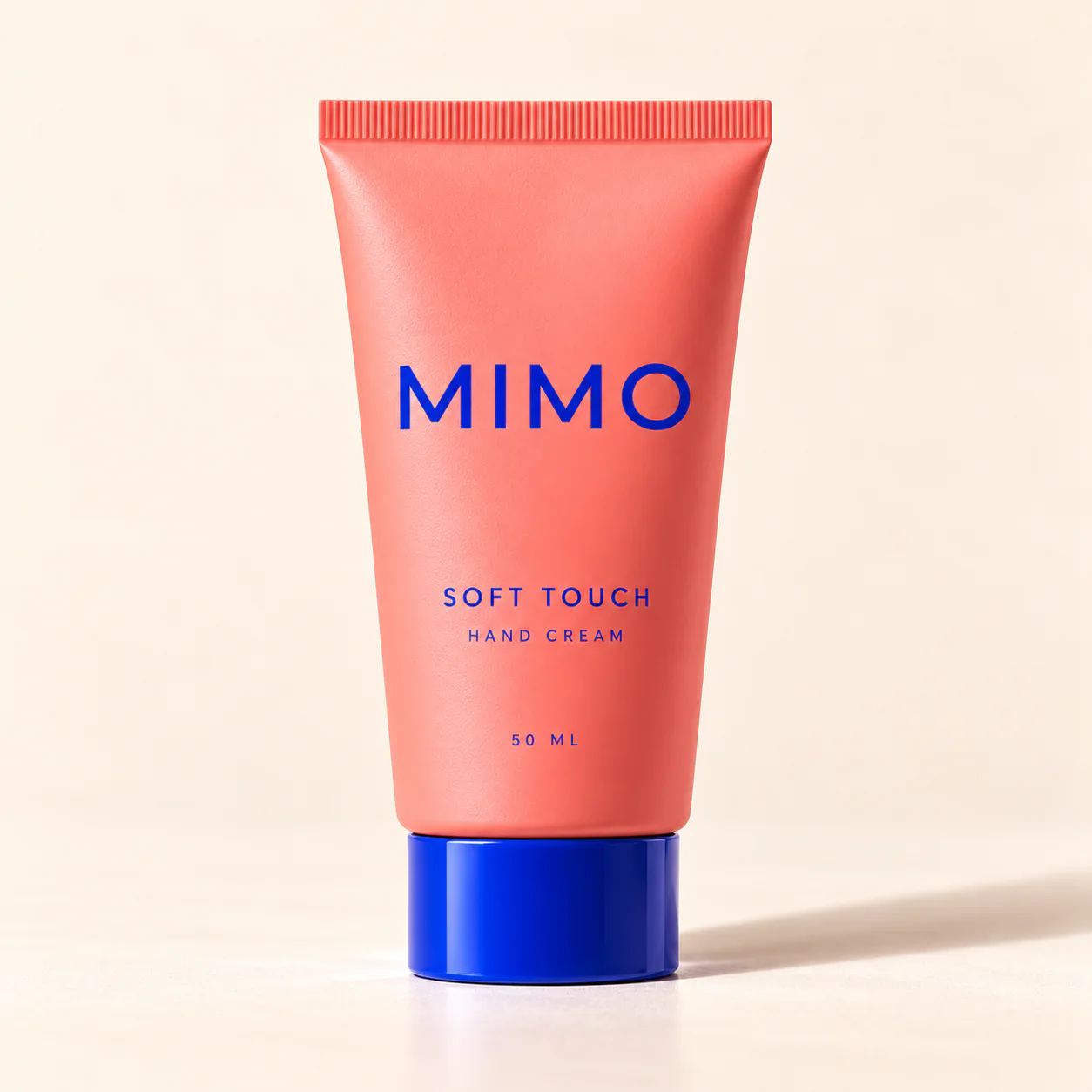ครีมทามือ MIMO Soft Touch หลอดสีปะการัง ฝาสีน้ำเงิน ตั้งตรง